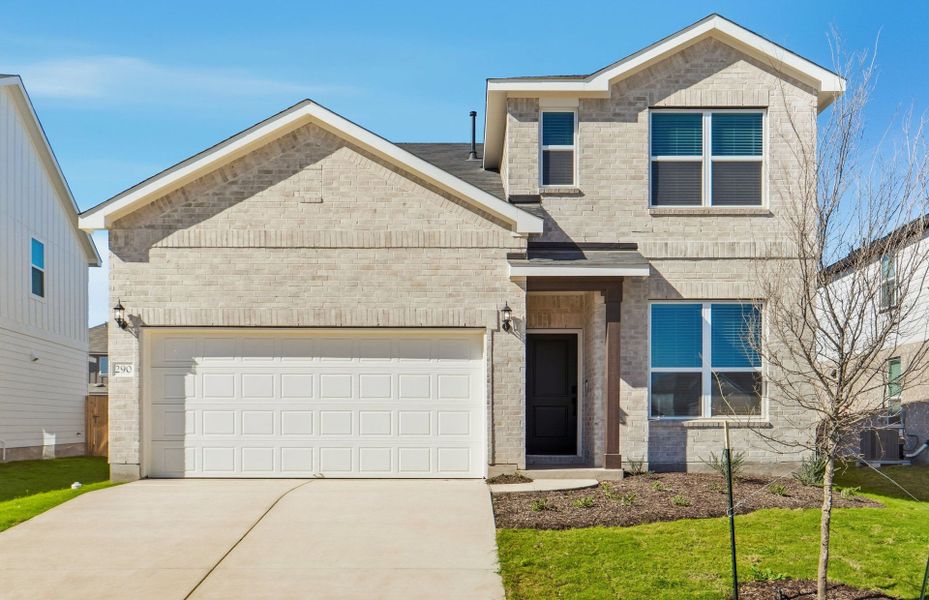 Front exterior of a new home in Sunfield, Buda, TX, highlighting curb appeal (Image 20). Front exterior of a new home in Sunfield, Buda, TX, highlighting curb appeal (Image 20).