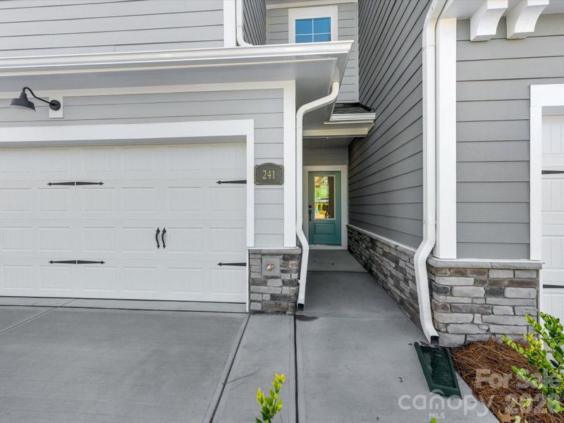side by side two car garage, covered front porch