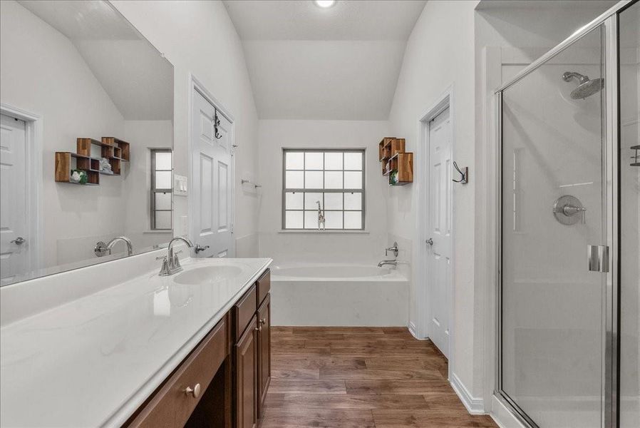 The private en-suite bath features a walk-in shower, soaking tub, double sinks and a walk-in closet The private en-suite bath features a walk-in shower, soaking tub, double sinks and a walk-in closet