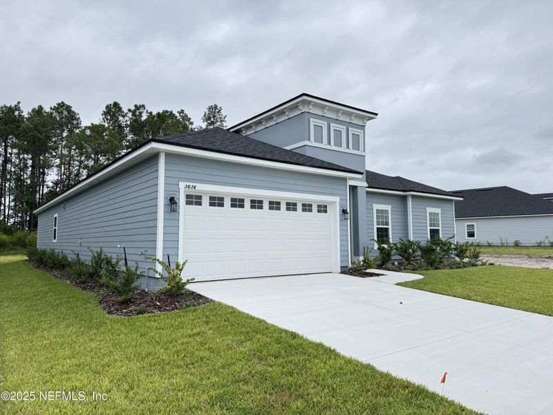 Front exterior of a new home in Hyland Trail, Green Cove Springs, FL, highlighting curb appeal (Image 1).