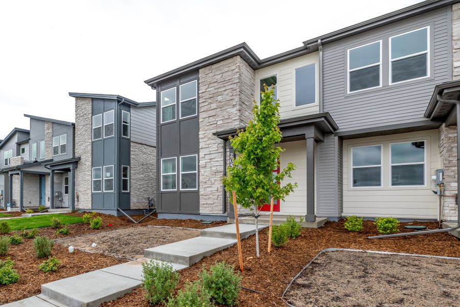 Front exterior of a new home in Painted Prairie, Aurora, CO, highlighting curb appeal (Image 22).