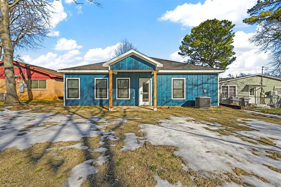 View of front of house featuring central AC