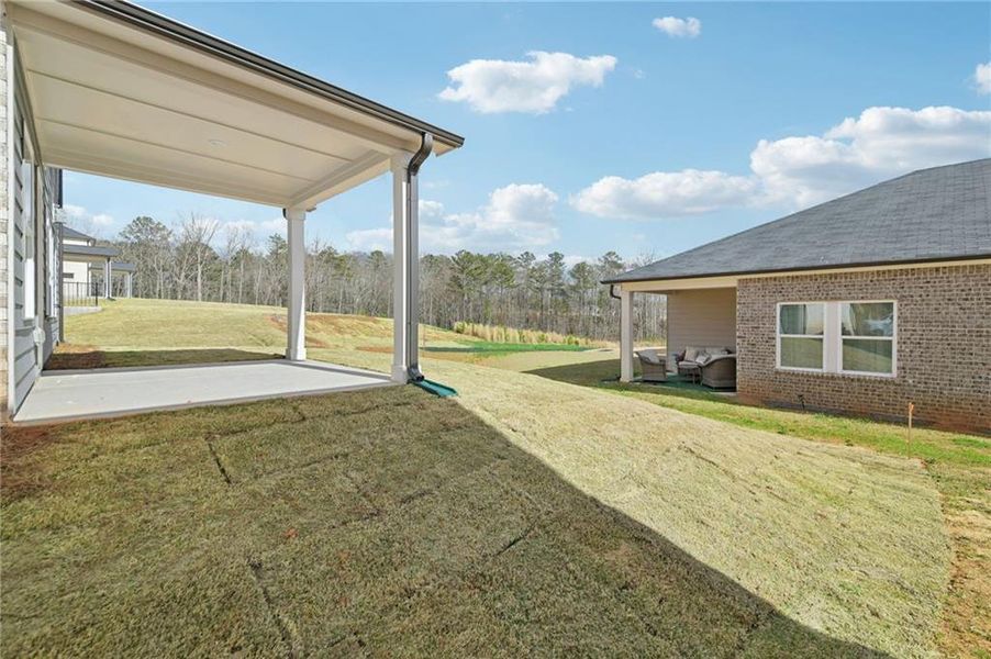 Exterior details and patio area of a home in Creekside at Oxford Park, Fairburn (Image 33).