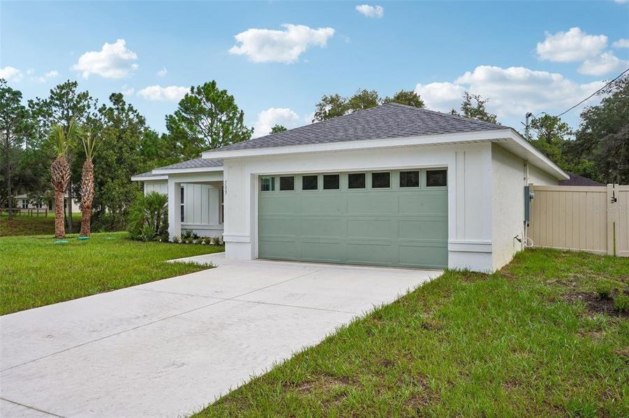 Front exterior of a new home in , Citrus Springs, FL, highlighting curb appeal (Image 23).