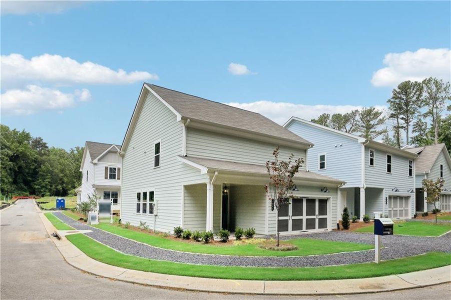 Front exterior of a new home in Parkside, Clarkston, GA, highlighting curb appeal (Image 1).