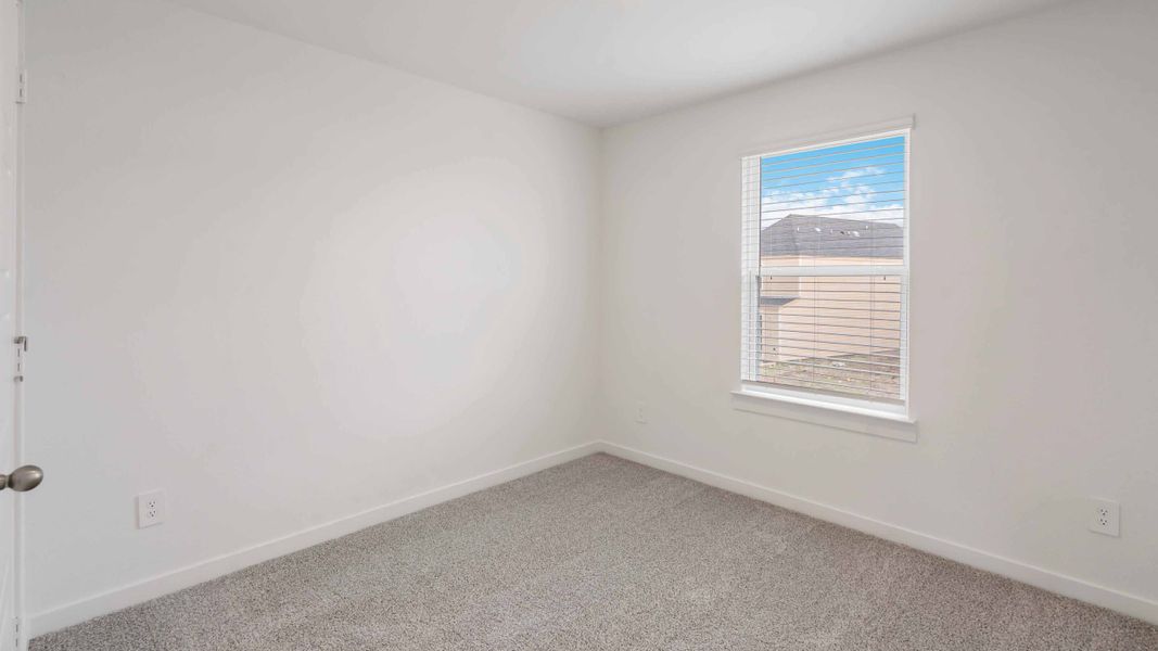 Representative unfurnished interior of a home built from the Iris by D.R. Horton in City Gate North, Houston (Image 13).