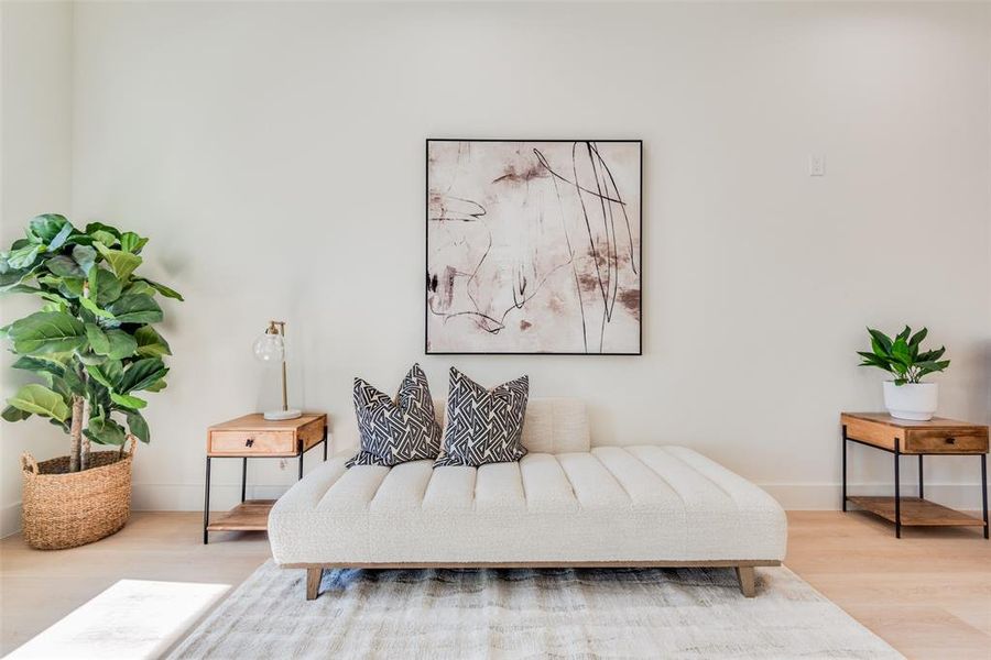 Living area with light hardwood / wood-style flooring