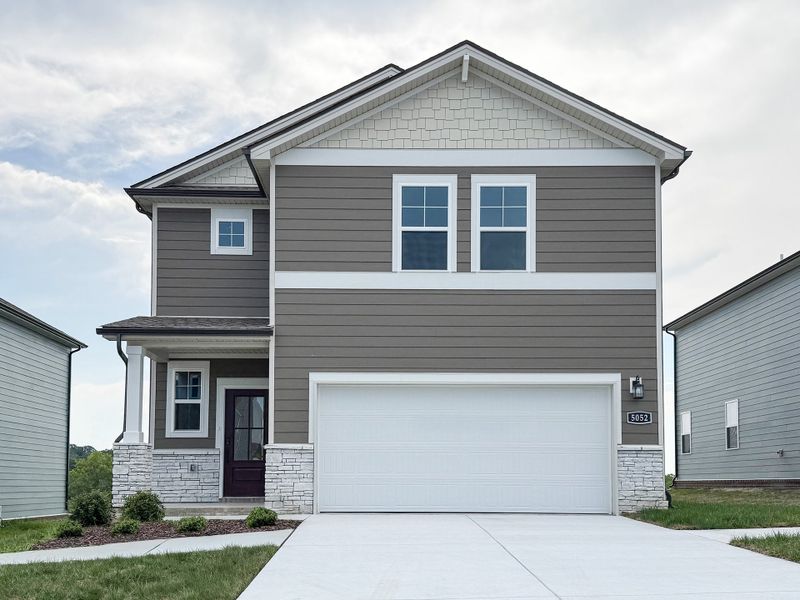 Front exterior of a new home in Canebrake at Hickory Hills, Old Hickory, TN, highlighting curb appeal (Image 1).