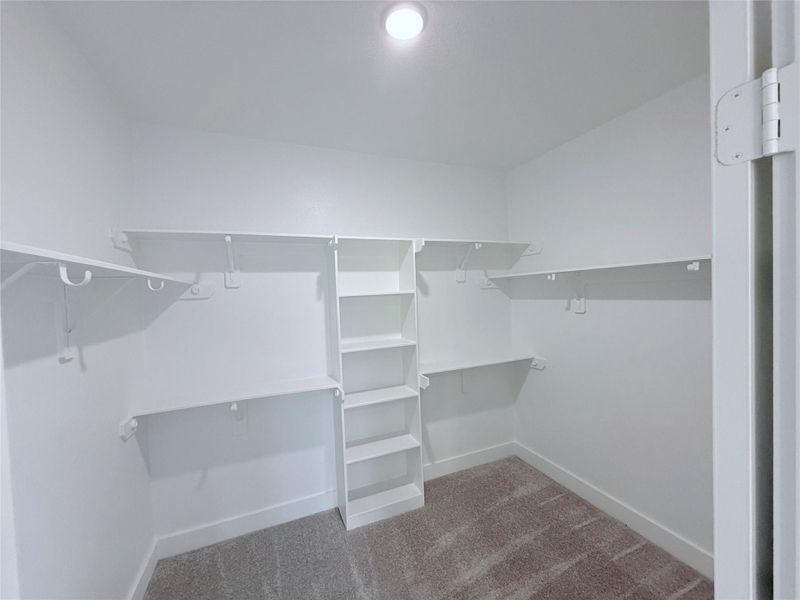 Primary walk in closet Primary walk in closet
