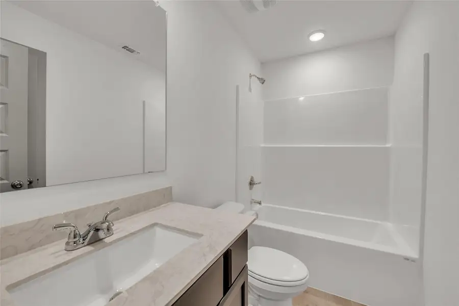 Bathroom with bathtub / shower combination and vanity