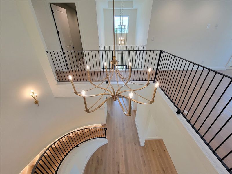 Spiral staircase serves as a stunning architectural focal point, featuring integrated hidden LED lighting that accentuates its elegant design. Spiral staircase serves as a stunning architectural focal point, featuring integrated hidden LED lighting that accentuates its elegant design.