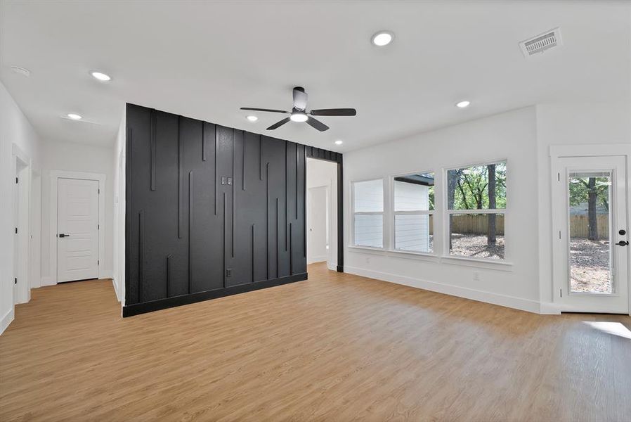 Unfurnished living room featuring light wood-type flooring, recessed lighting, and a ceiling fan