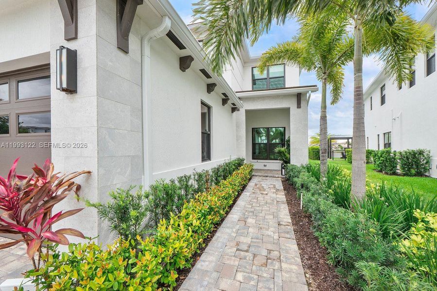 Exterior details and patio area of a home in Solana Bay at Avenir, Palm Beach Gardens (Image 26).
