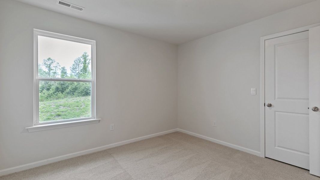 Spacious, unfurnished interior of a new home in The Grove at Matthews Landing, Fuquay Varina (Image 23).