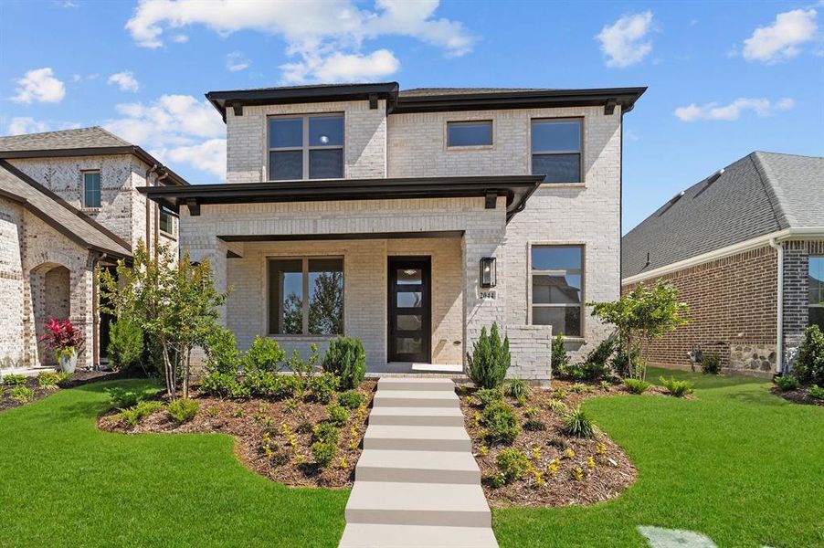 Front exterior of a new home in Mantua Point Gardens, Van Alstyne, TX, highlighting curb appeal (Image 1).