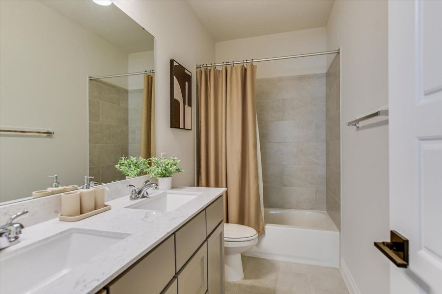 Downstairs bathroom next to the secondary bedroom