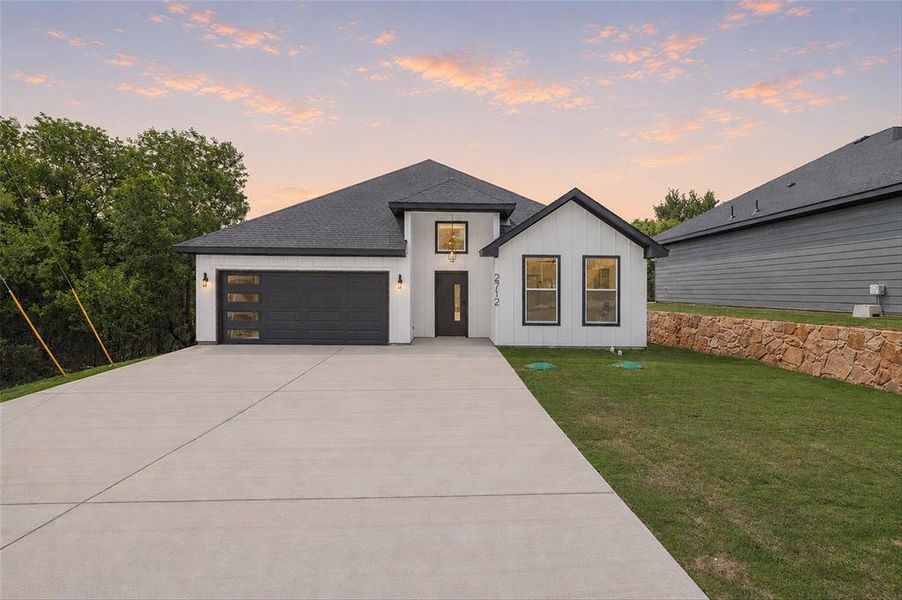 Front exterior of a new home in , Granbury, TX, highlighting curb appeal (Image 2). Front exterior of a new home in , Granbury, TX, highlighting curb appeal (Image 2).