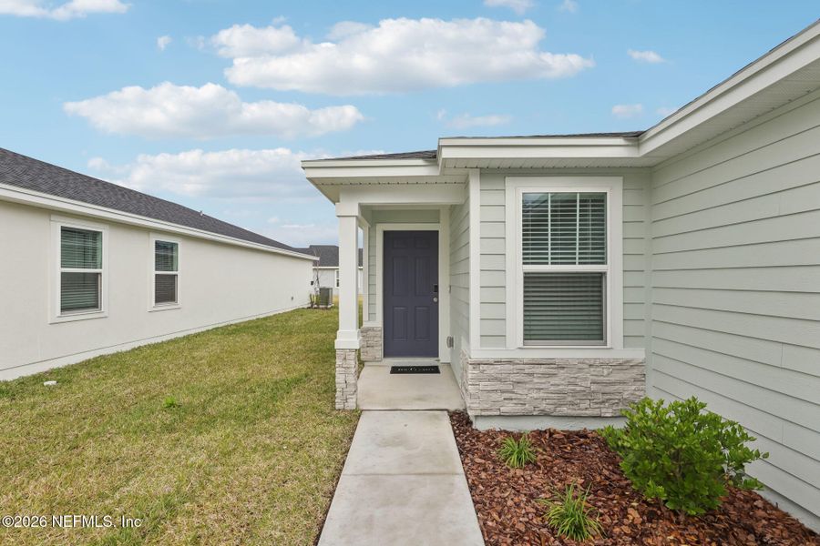 Exterior details and patio area of a home in Flagler Village - Classic Series, Palm Coast (Image 3).