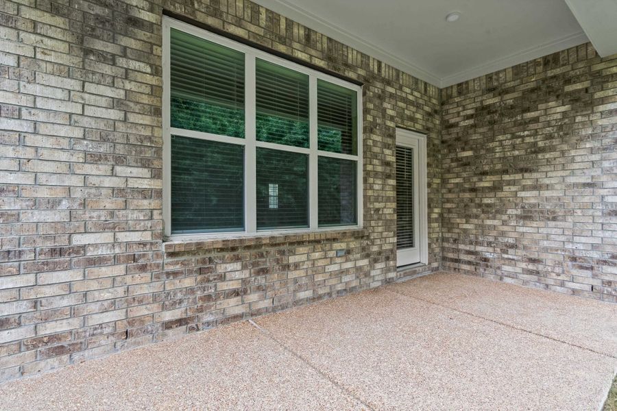 Covered patio with a textured aggregate surface Covered patio with a textured aggregate surface