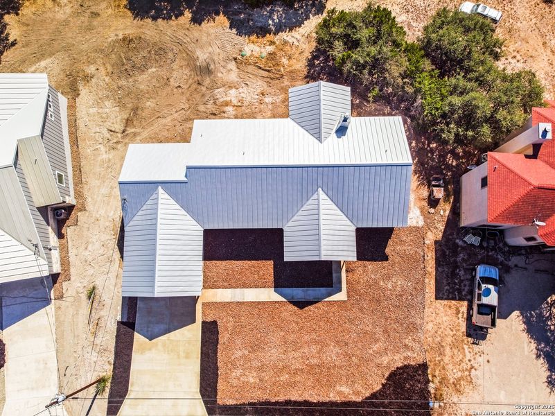 Front exterior of a new home in , Lakehills, TX, highlighting curb appeal (Image 18).