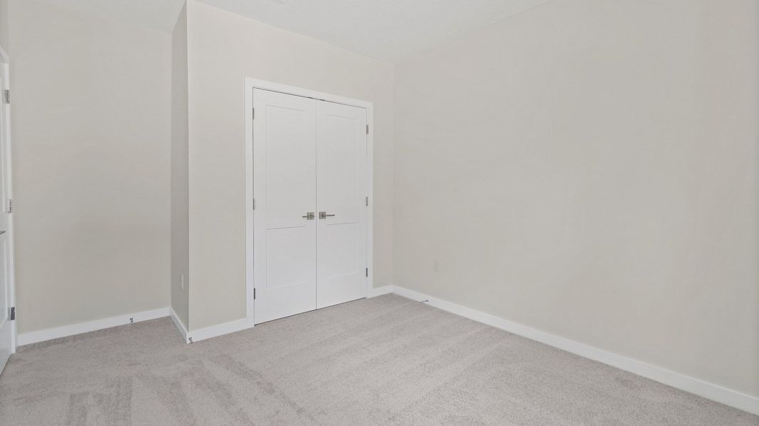 This flex room in The Atlantic works great as a guest bedroom, office, or hobby space with a closet and carpeted flooring. This flex room in The Atlantic works great as a guest bedroom, office, or hobby space with a closet and carpeted flooring.