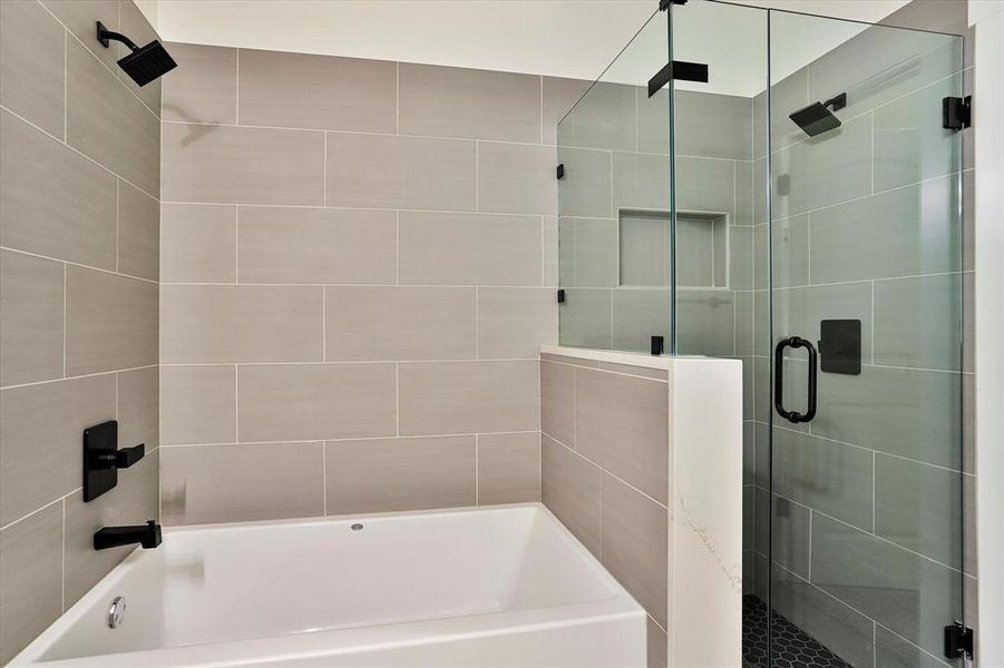 Bathroom featuring separate shower and tub