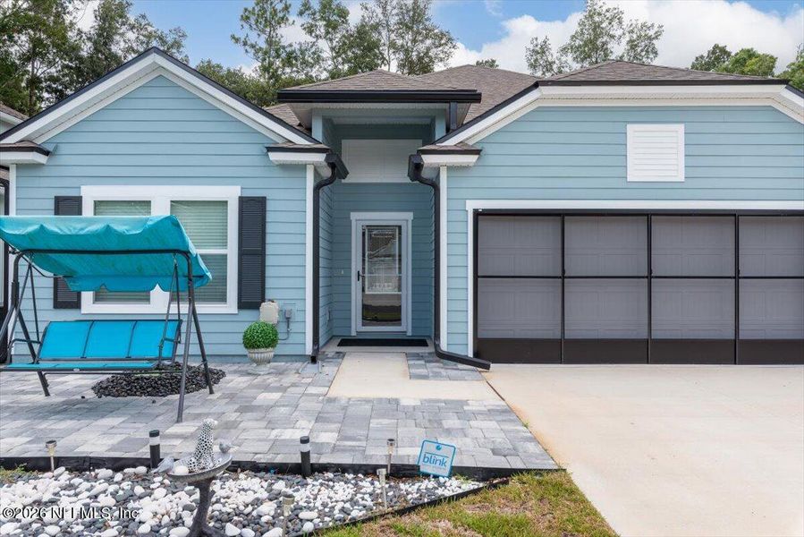 Front exterior of a new home in Pecan Ridge, Jacksonville, FL, highlighting curb appeal (Image 23).