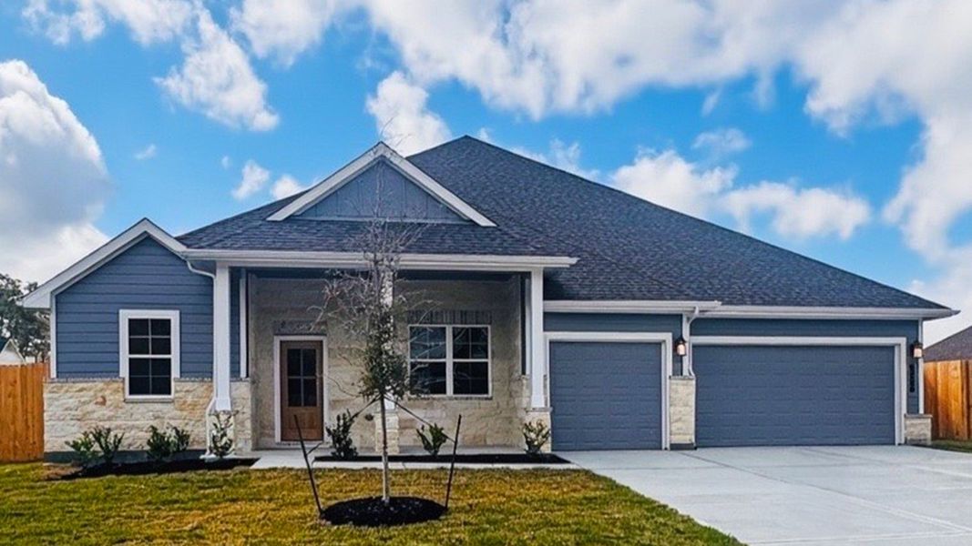Front exterior of a new home in The Woods, Lumberton, TX, highlighting curb appeal (Image 1). Front exterior of a new home in The Woods, Lumberton, TX, highlighting curb appeal (Image 1).