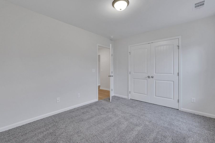 Representative unfurnished interior of a home built from the The Birch by Smith Family Homes in Lakeview Pines, Statesboro (Image 30).