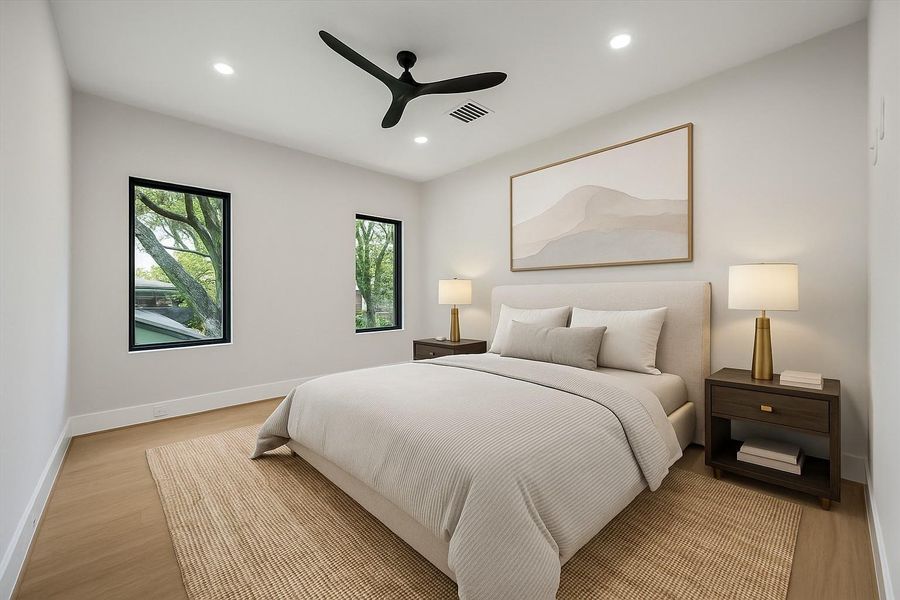 Virtually Staged. This spacious secondary bedroom balances comfort and versatility, highlighted by a walk-in closet with custom built-ins for organized storage. Its generous proportions provide flexibility for relaxation, work, or study.