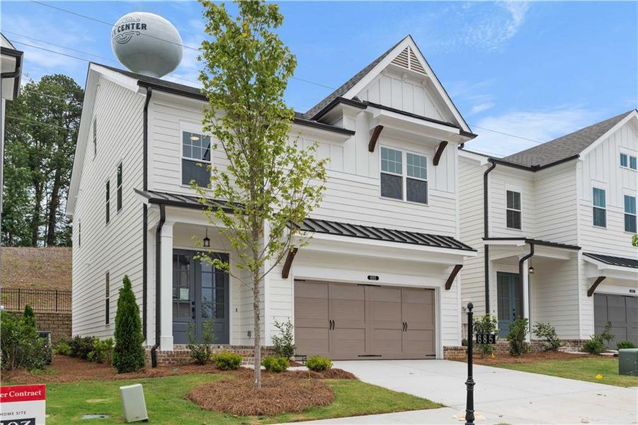 Front exterior of a new home in Palisades Single Family, Cumming, GA, highlighting curb appeal (Image 25).