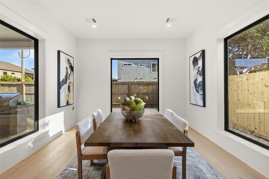Every dinner feels like a special occasion with a dining space framed by expansive windows and seamless views of your outdoor living area.