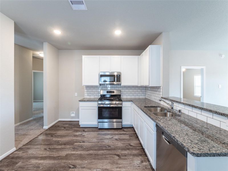 Furnished interior view inside a new home in Sweetgrass Village, Crosby (Image 4).