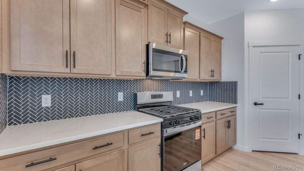 Furnished interior view inside a new home in Trails at Crowfoot, Parker (Image 9).