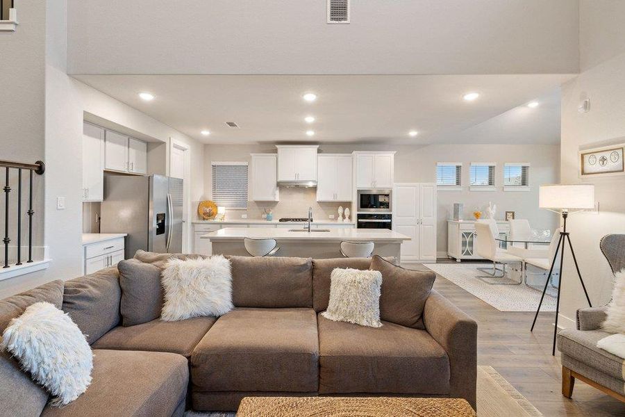 Seamless flow from living area into kitchen and dining.