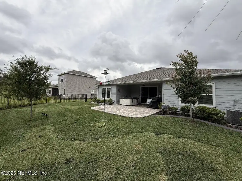 Exterior details and patio area of a home in Tributary, Yulee (Image 21).