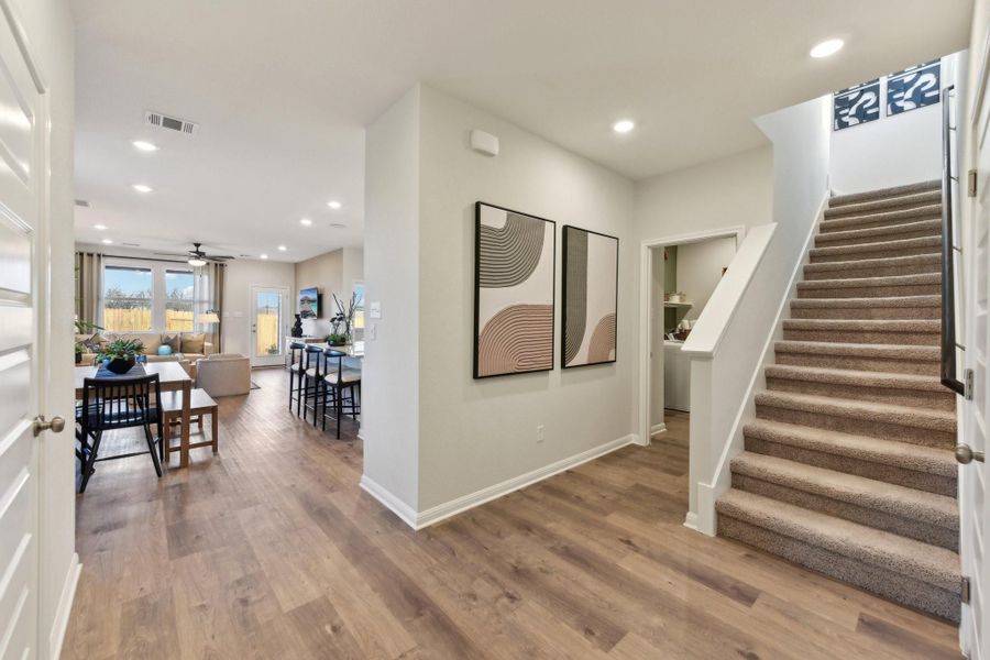 Entryway with stairway, wood finished floors, recessed lighting, and ceiling fan