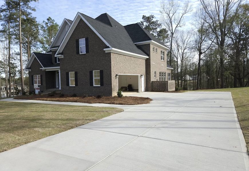 Representative exterior photo of a completed home built from the Berkeley by Hurricane Builders in Mount Vintage, North Augusta, SC (Image 34).