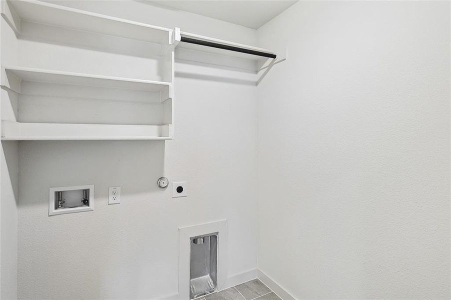 Laundry room featuring hookup for an electric dryer and hookup for a washing machine