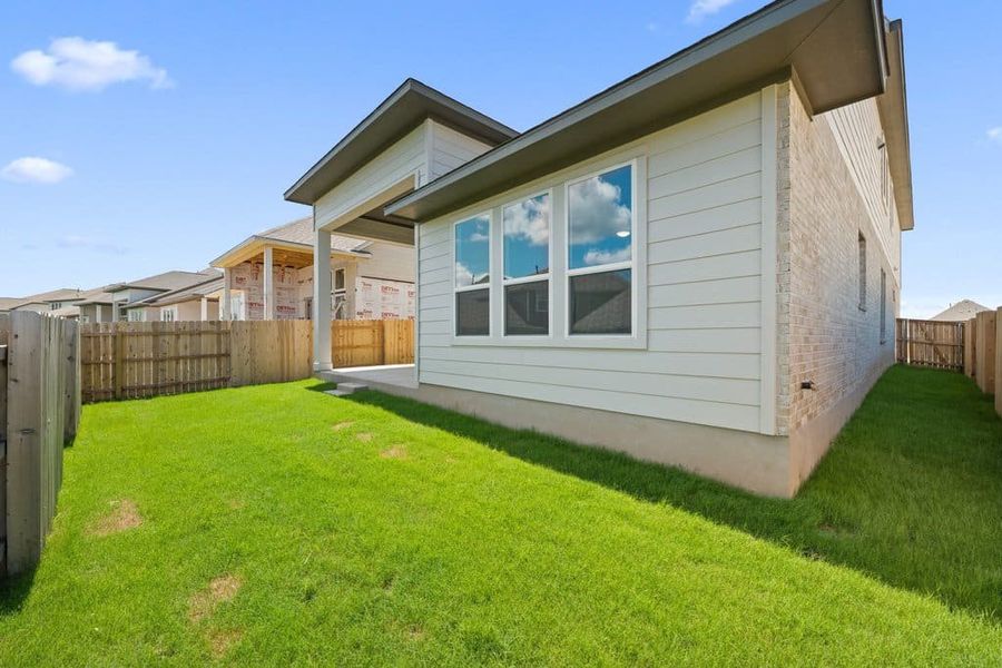 Exterior details and patio area of a home in Lariat, Liberty Hill (Image 26).