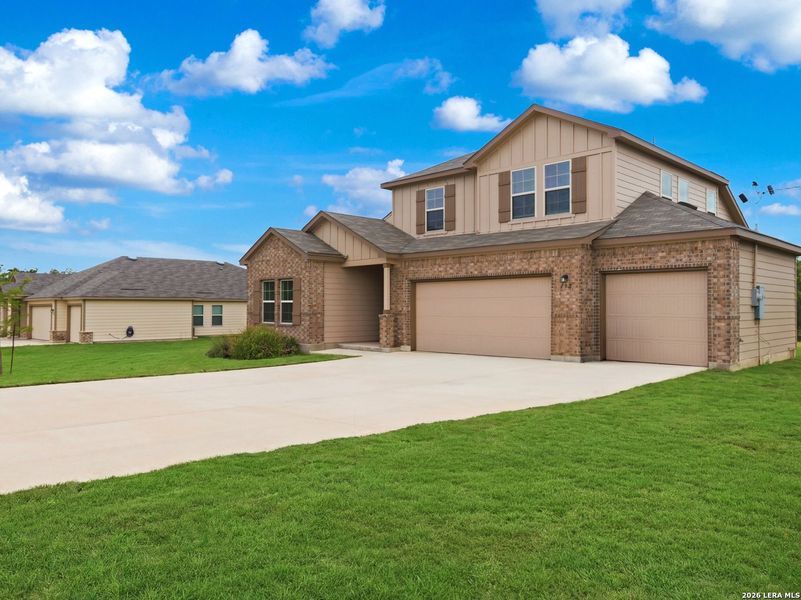 Front exterior of a new home in Chaparral Ranch, Floresville, TX, highlighting curb appeal (Image 25). Front exterior of a new home in Chaparral Ranch, Floresville, TX, highlighting curb appeal (Image 25).