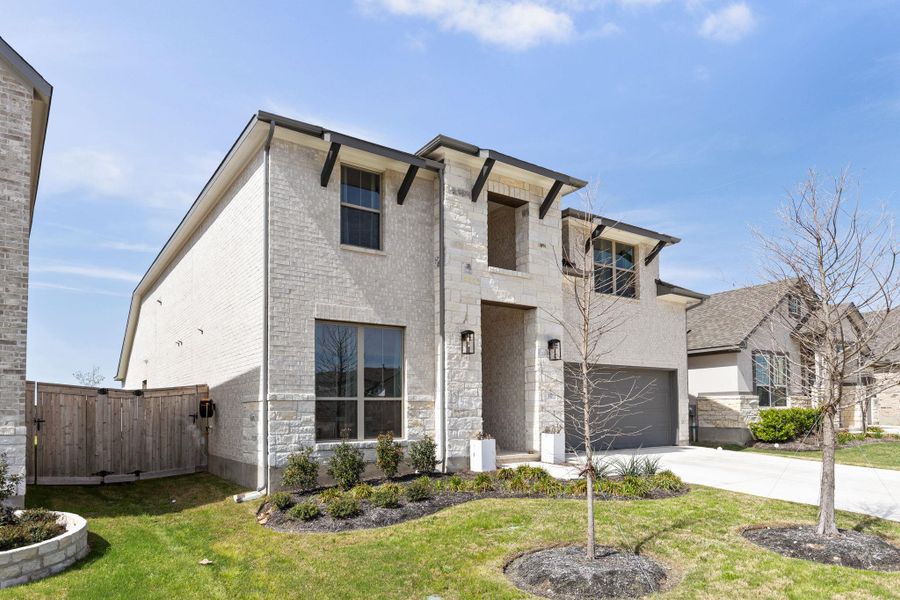 Front exterior of a new home in Nolina, Georgetown, TX, highlighting curb appeal (Image 1). Front exterior of a new home in Nolina, Georgetown, TX, highlighting curb appeal (Image 1).