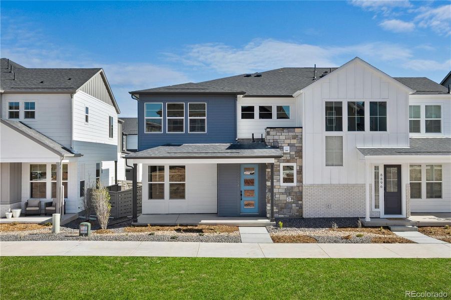 Front exterior of a new home in , Littleton, CO, highlighting curb appeal (Image 1).