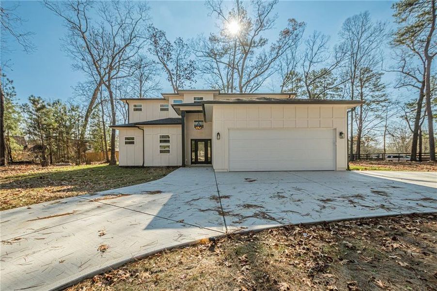 Front exterior of a new home in , Powder Springs, GA, highlighting curb appeal (Image 2). Front exterior of a new home in , Powder Springs, GA, highlighting curb appeal (Image 2).
