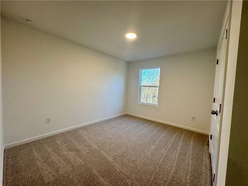 Spacious, unfurnished interior of a new home in Eastlyn Crossing, Flowery Branch (Image 21).
