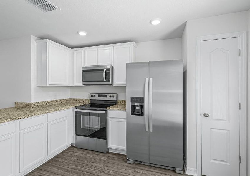 The kitchen comes chef ready with stainless steel appliances