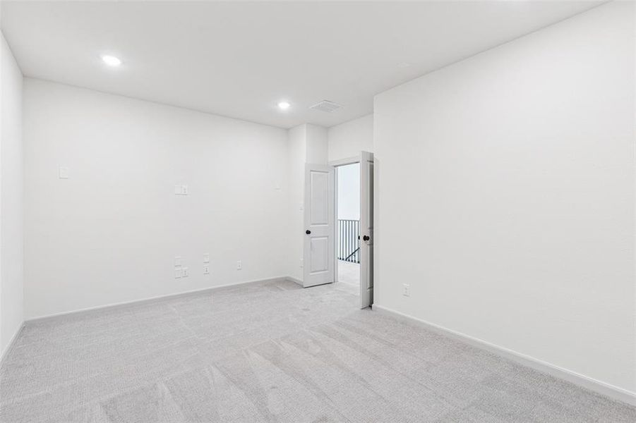 This spacious media room with adjacent game room create the ultimate entertainment area!