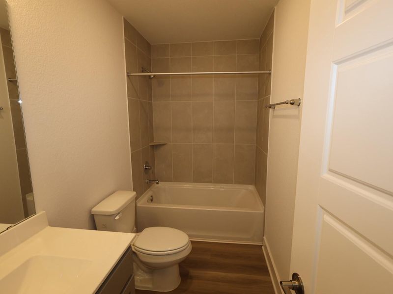 Furnished interior view inside a new home in Lone Star Landing, Montgomery (Image 6).