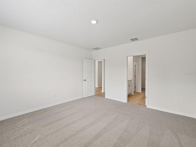 Spacious, unfurnished interior of a new home in The Reserve at Van Oaks, Auburndale (Image 22).