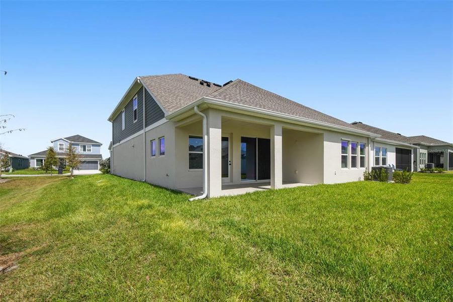 Exterior details and patio area of a home in The Peninsula at Rhodine Lake, Riverview (Image 26). Exterior details and patio area of a home in The Peninsula at Rhodine Lake, Riverview (Image 26).